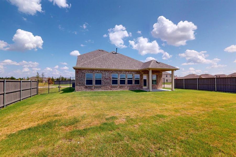 Exterior details and patio area of a home in Prairie Ridge at Goodland, Venus (Image 4). Exterior details and patio area of a home in Prairie Ridge at Goodland, Venus (Image 4).