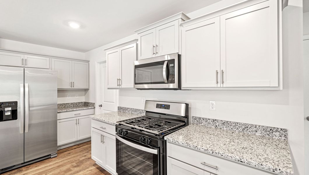 Furnished interior view inside a new home in Paddock Point, Roebuck (Image 9).