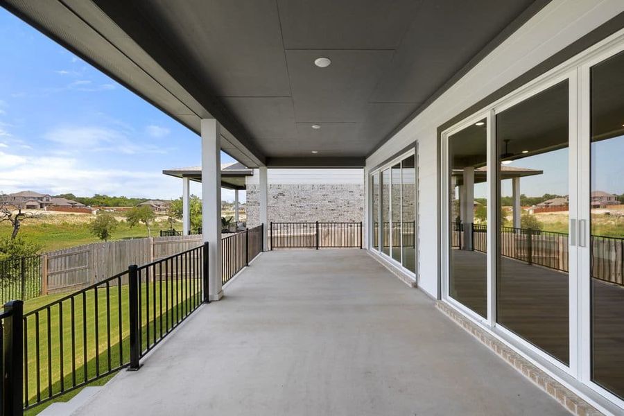 Exterior details and patio area of a home in Lariat, Liberty Hill (Image 30).