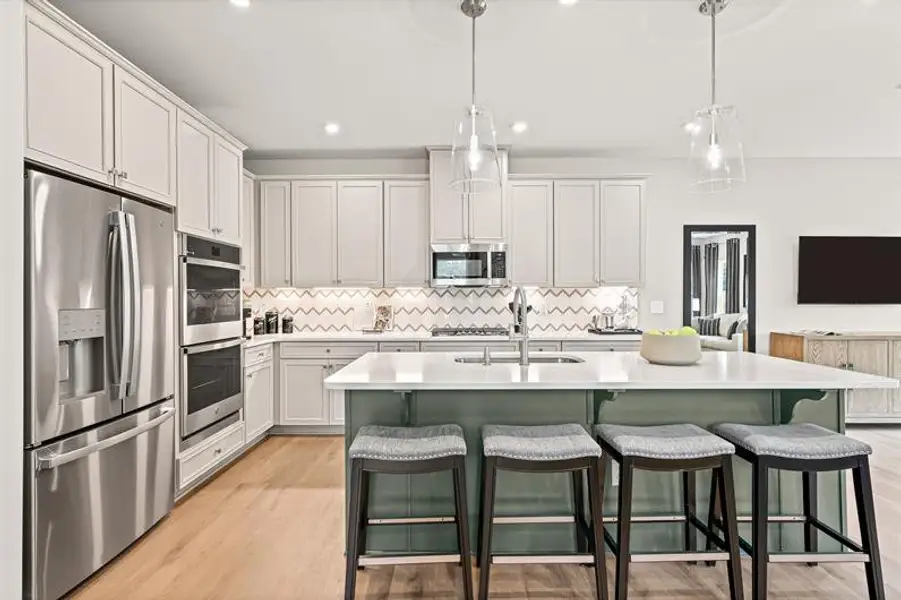 Representative furnished interior of a home built from the Roxbury Grande by Ryan Homes in Griffin Farm Townes, Pittsboro (Image 3).