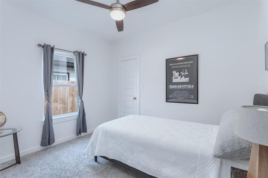 Bedroom featuring carpet and ceiling fan