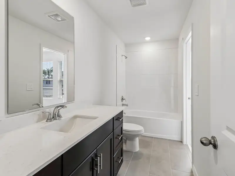 Furnished interior view inside a new home in Bradford Park, Ormond Beach (Image 5).