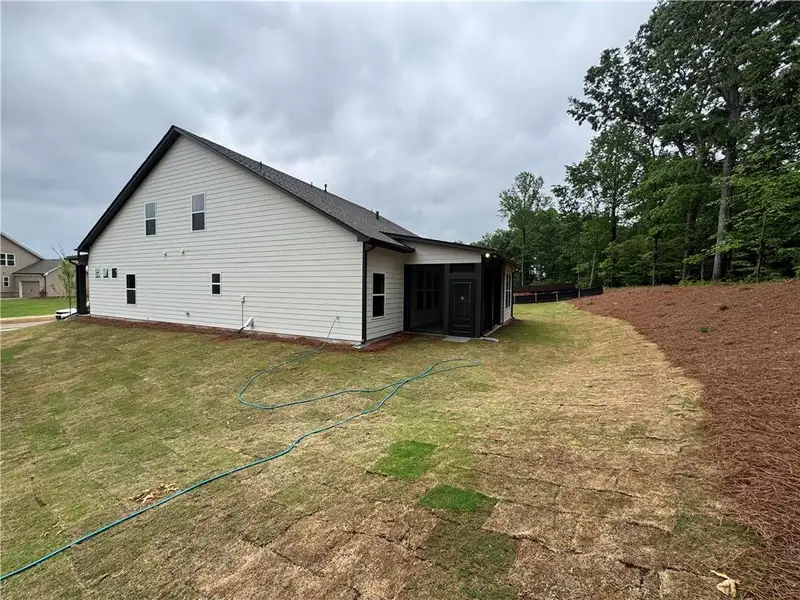 Exterior details and patio area of a home in Rosewood Lake Preserve, Hoschton (Image 3).
