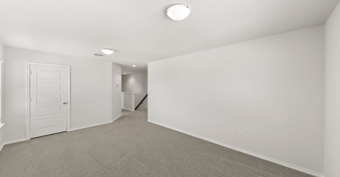 Representative exterior photo of a completed home built from the Raleigh by Impression Homes in Baker Farms, Cleburne, TX (Image 11).