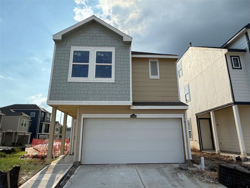 Two-story home with 3 bedrooms, 2.5 baths and 2 car garage on a corner lot