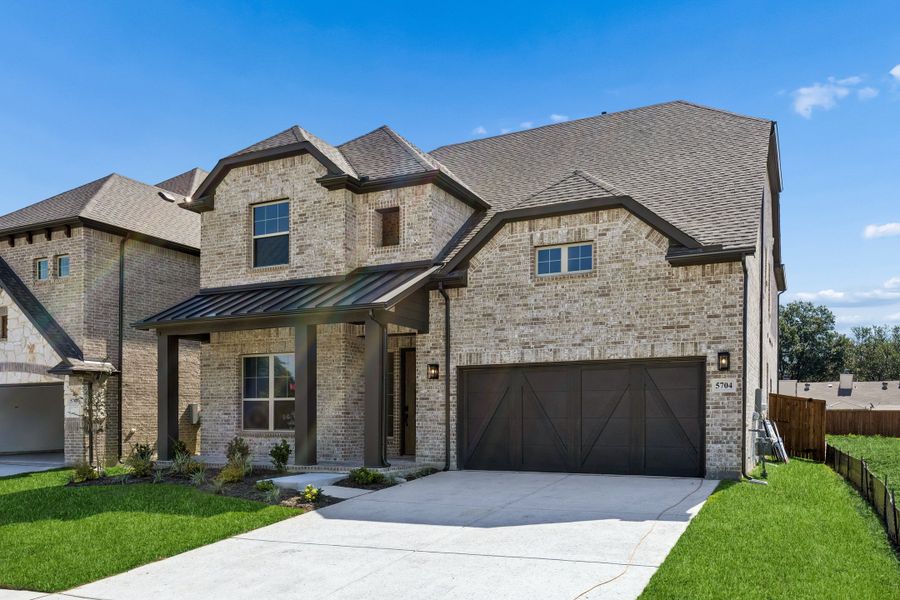 Front exterior of a new home in Cambridge Manor, North Richland Hills, TX, highlighting curb appeal (Image 2). Front exterior of a new home in Cambridge Manor, North Richland Hills, TX, highlighting curb appeal (Image 2).