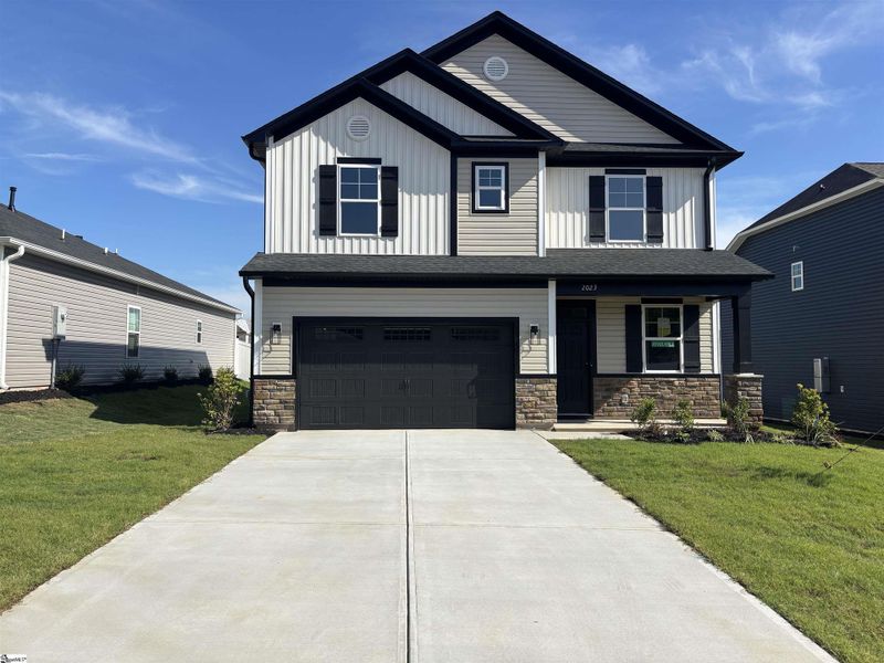 Front exterior of a new home in Halton Oaks, Spartanburg, SC, highlighting curb appeal (Image 1).