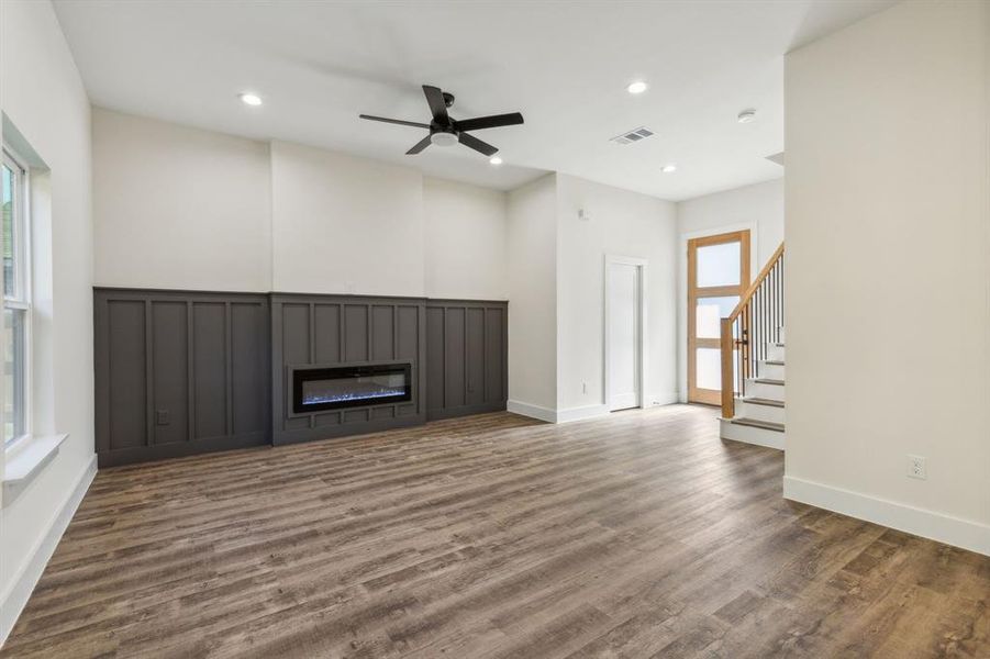 View towards the fireplace and wainscoting.