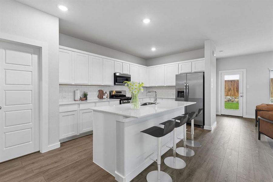 Kitchen in the Oscar home plan by Trophy Signature Homes – REPRESENTATIVE PHOTO