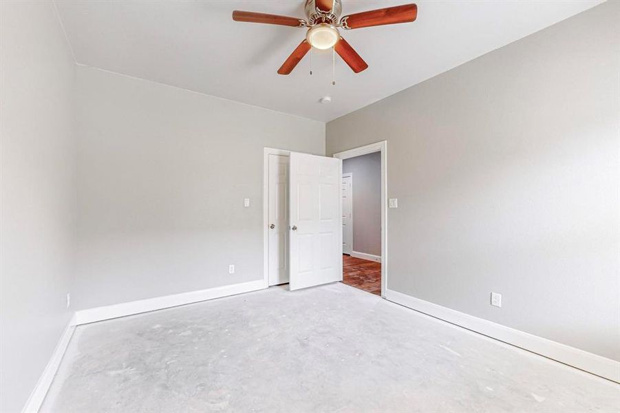 Spare room with ceiling fan