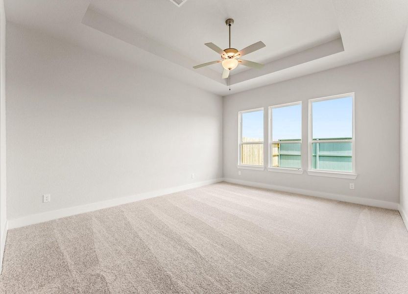 Primary Bedroom with Walk-in Closet and Fan Primary Bedroom with Walk-in Closet and Fan