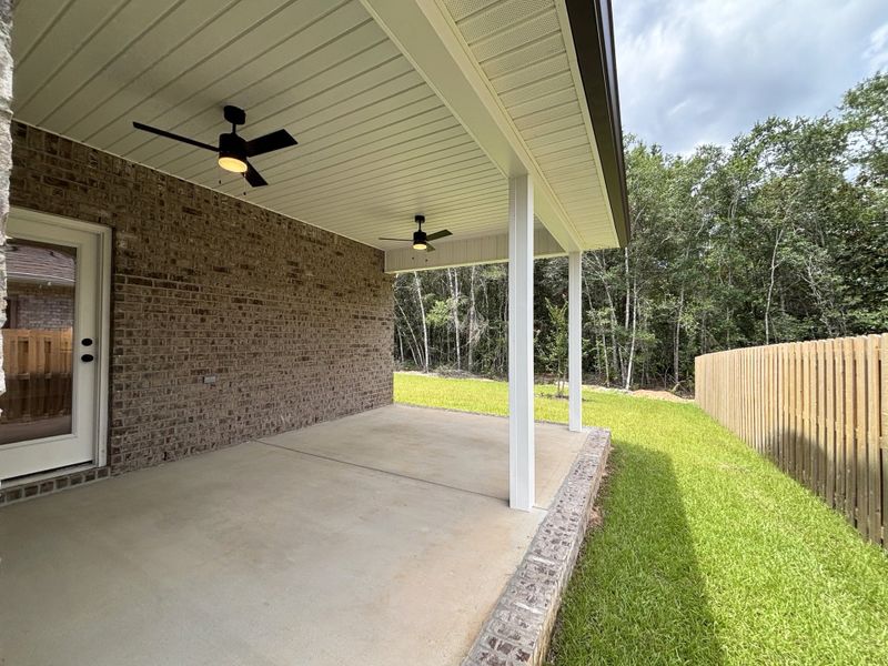 Exterior details and patio area of a home in Bird Song at Hammock Bay, Freeport (Image 3).