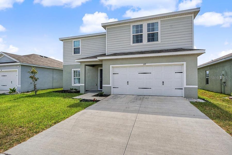 Front exterior of a new home in , Brooksville, FL, highlighting curb appeal (Image 2). Front exterior of a new home in , Brooksville, FL, highlighting curb appeal (Image 2).