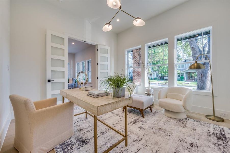 Living area with hardwood / wood-style flooring and built in features