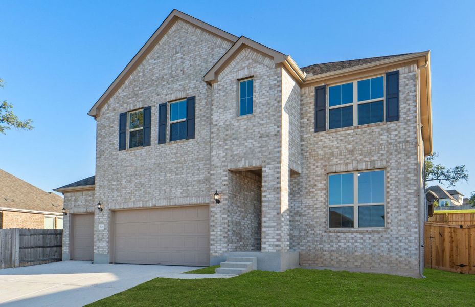 Front exterior of a new home in Crescent Bluff, Georgetown, TX, highlighting curb appeal (Image 21).