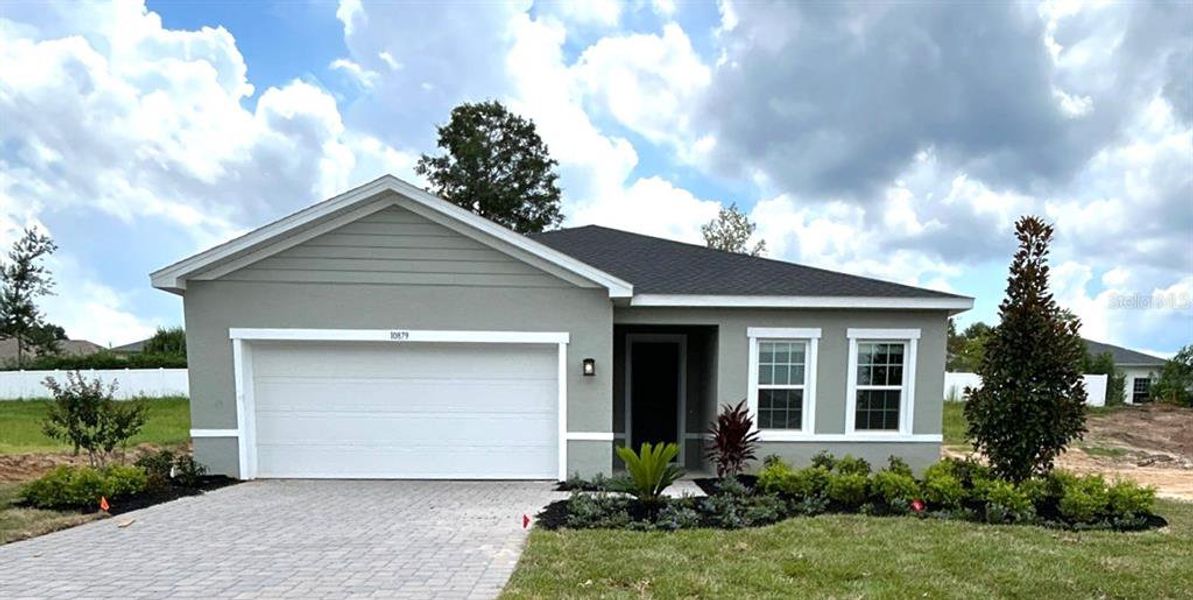 Front exterior of a new home in Copperleaf, Ocala, FL, highlighting curb appeal (Image 1).