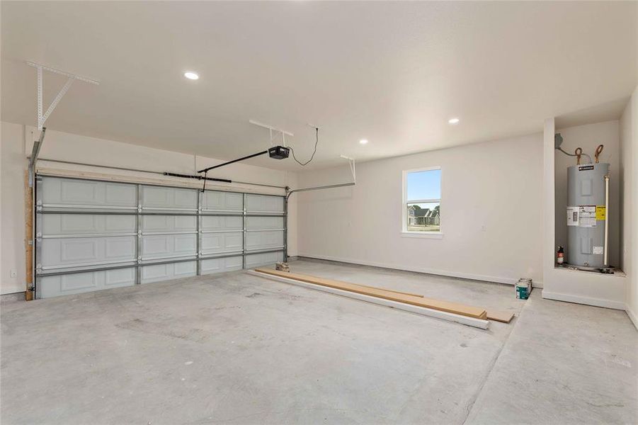 Garage with recessed lighting and water heater Garage with recessed lighting and water heater