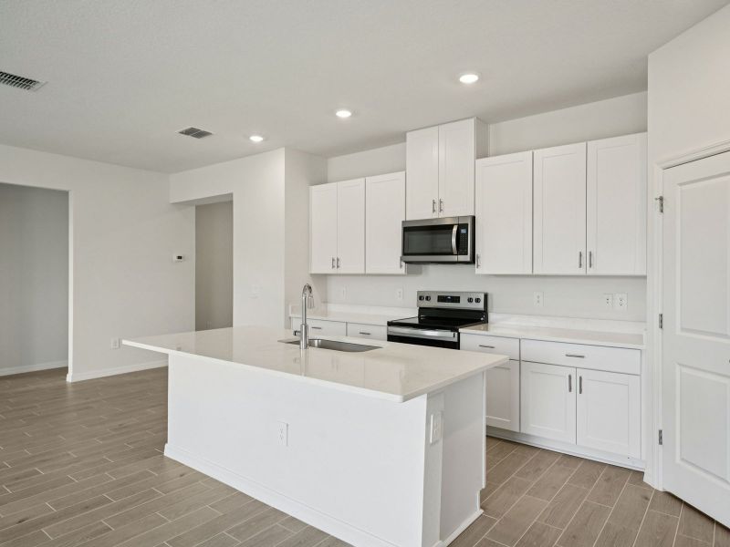 Furnished interior view inside a new home in Two Rivers - Classic Series, Zephyrhills (Image 4).