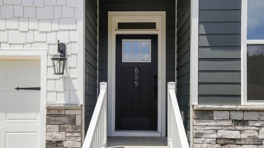 Exterior details and patio area of a home in Sunset Summits, Spartanburg (Image 3).