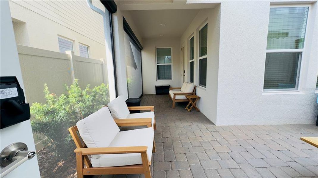 Exterior details and patio area of a home in Harvest at Ovation, Winter Garden (Image 4).