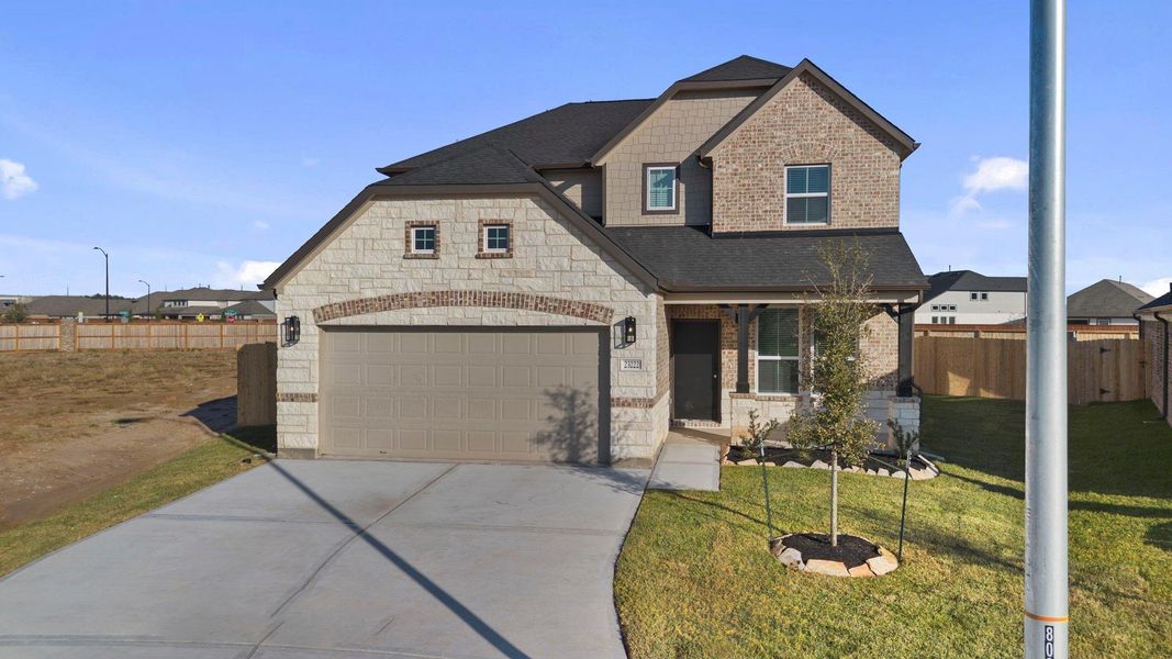 Front exterior of a new home in Morton Creek Ranch, Katy, TX, highlighting curb appeal (Image 21).