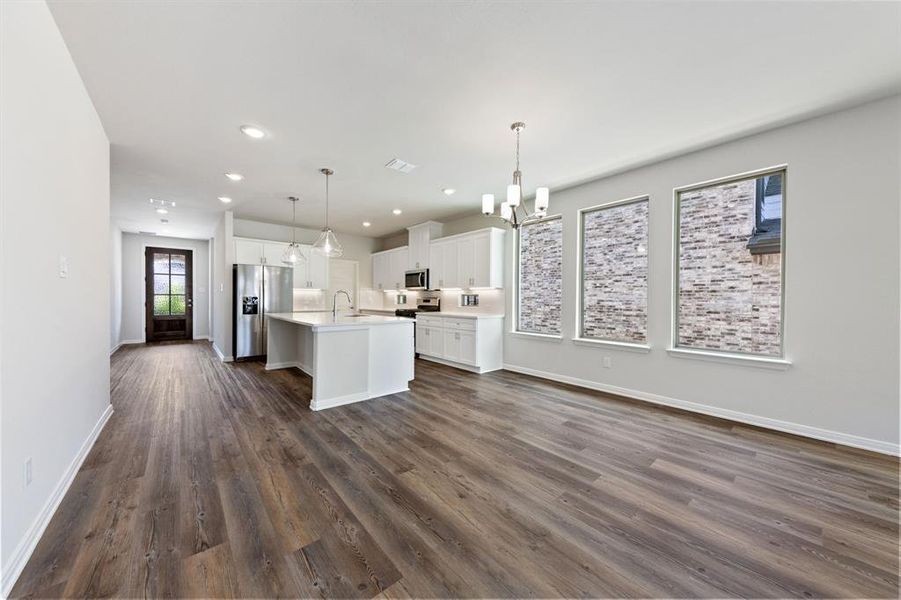 Adjacent to the kitchen, this lovely dining area is the perfect place for cozy family meals or fun dinner parties!