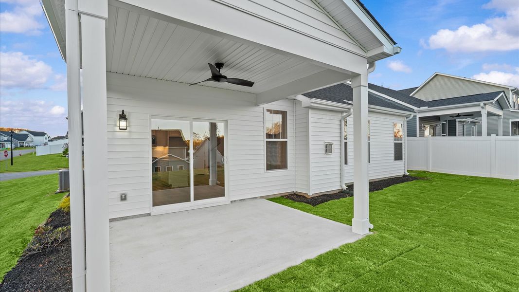 Rear covered porch offers a private, first-rate setting for outdoor enjoyment