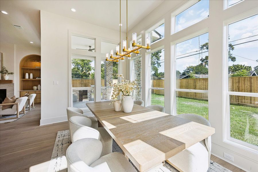 Pull up a chair and stay awhile. This sunny dining area flows effortlessly into the kitchen and living spaces, while a gorgeous chandelier sets the mood for everything from casual weeknight meals to lively dinner parties.