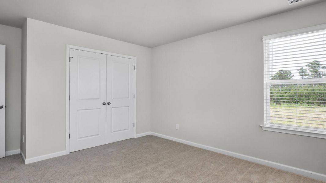 Spacious, unfurnished interior of a new home in Surfside Landing, Hubert (Image 28).