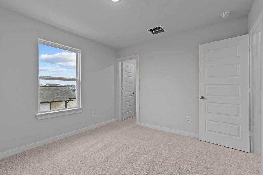 A room with a window and a door. A room with a window and a door.