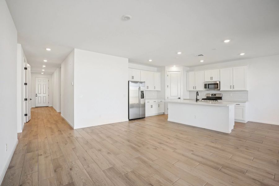 Great room and kitchen. Not actual home, finishes may vary by community. Great room and kitchen. Not actual home, finishes may vary by community.