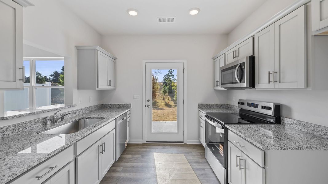 Furnished interior view inside a new home in Tanglewood Townes, Greenville (Image 5).