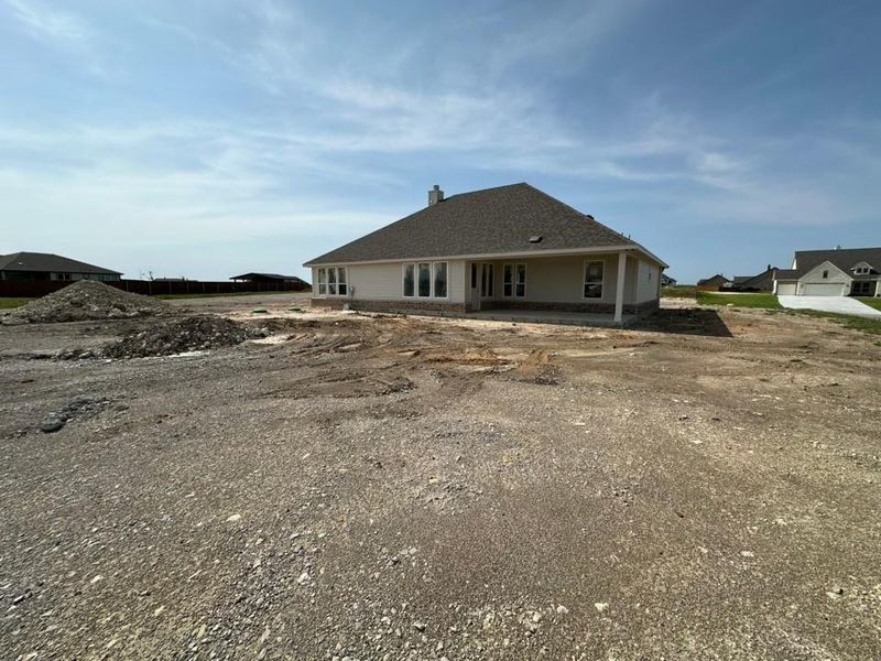 Front exterior of a new home in Hillcrest Meadows North, Decatur, TX, highlighting curb appeal (Image 2). Front exterior of a new home in Hillcrest Meadows North, Decatur, TX, highlighting curb appeal (Image 2).