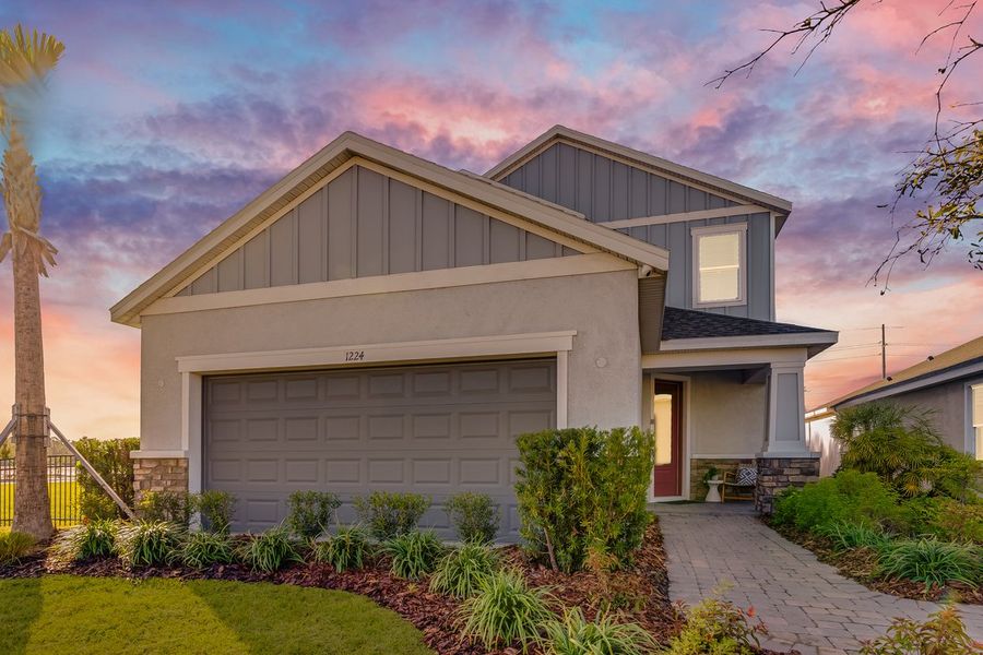 Front exterior of a new home in Center Lake Ranch Community Group Page, St. Cloud, FL, highlighting curb appeal (Image 23).