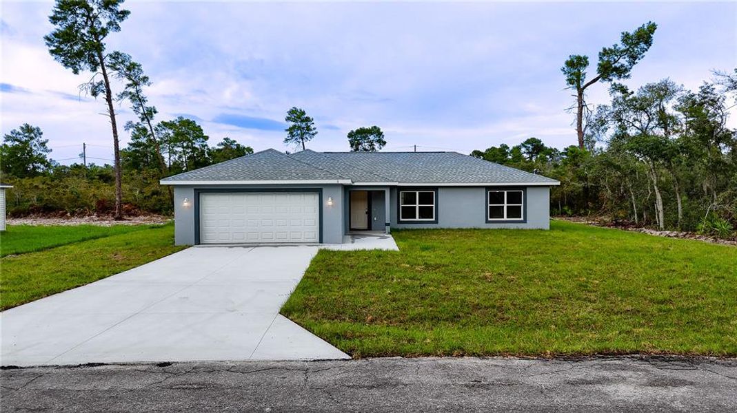 Front exterior of a new home in , Ocklawaha, FL, highlighting curb appeal (Image 19). Front exterior of a new home in , Ocklawaha, FL, highlighting curb appeal (Image 19).
