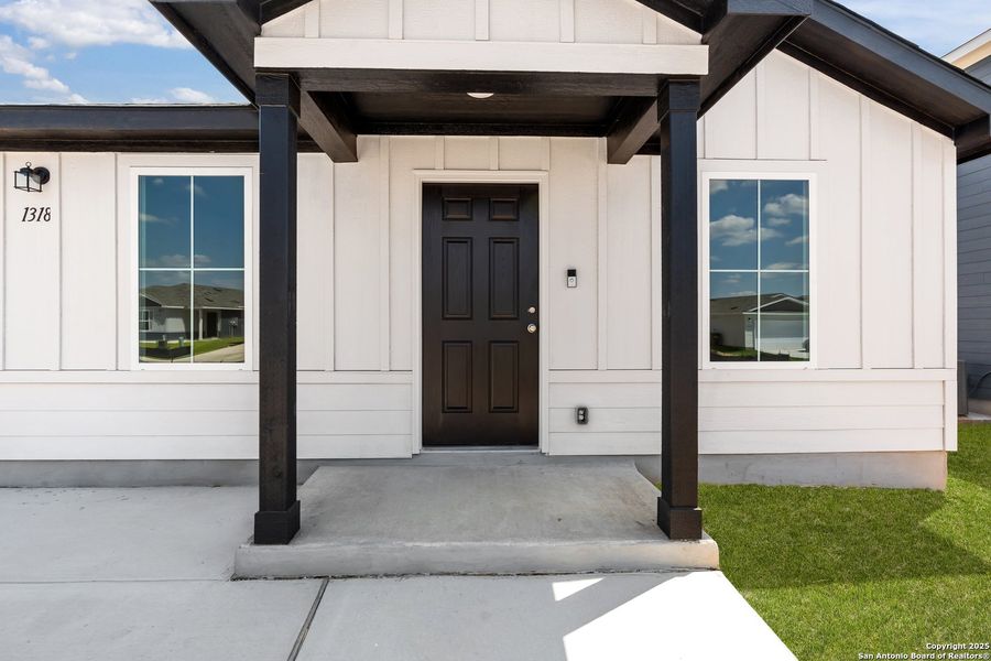 Front exterior of a new home in Vista Real, Converse, TX, highlighting curb appeal (Image 20).