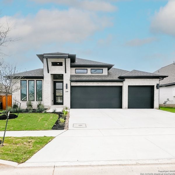 Front exterior of a new home in Veramendi 60', New Braunfels, TX, highlighting curb appeal (Image 2). Front exterior of a new home in Veramendi 60', New Braunfels, TX, highlighting curb appeal (Image 2).