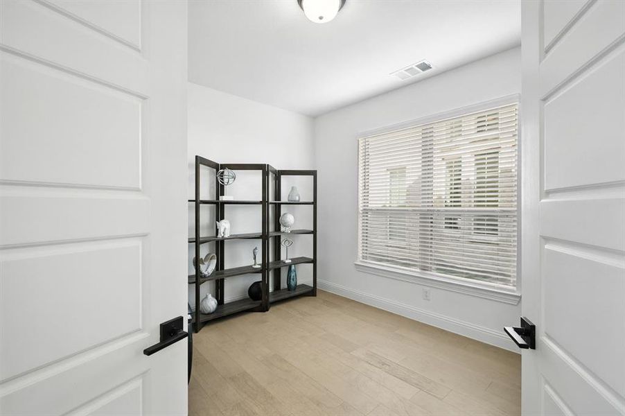 Dedicated office room downstairs near the front door.