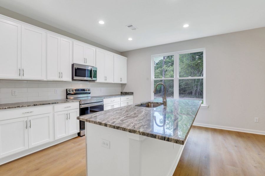 Representative furnished interior of a home built from the The Brookhaven by Smith Family Homes in Ramsey Landing, Rincon (Image 14).