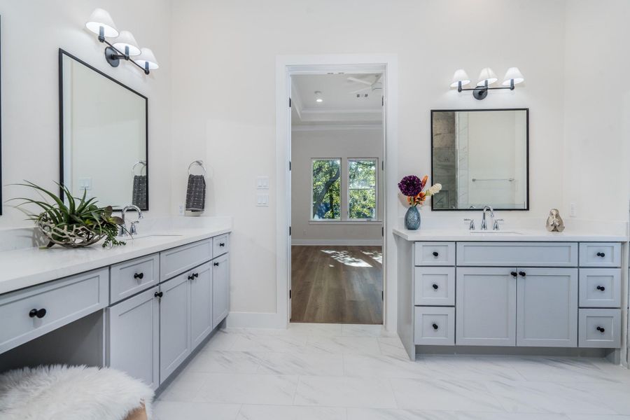 Luxurious primary ensuite with dual vanities, upgraded fixtures, and a bright, elegant design that offers both style and functionality. Luxurious primary ensuite with dual vanities, upgraded fixtures, and a bright, elegant design that offers both style and functionality.