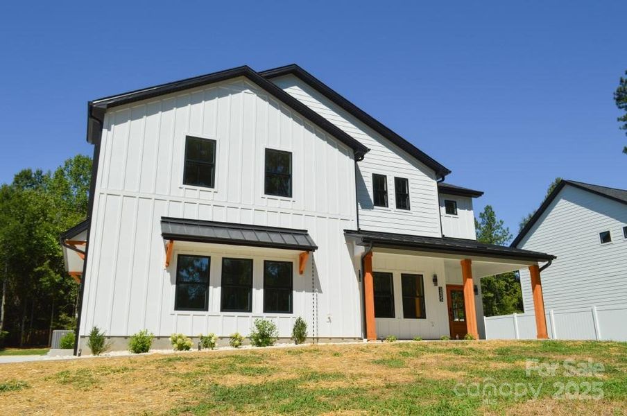 Front exterior of a new home in , Davidson, NC, highlighting curb appeal (Image 22).
