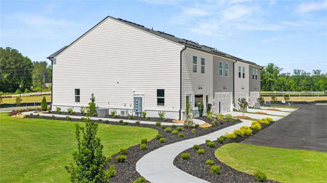 Front exterior of a new home in , Stockbridge, GA, highlighting curb appeal (Image 31).