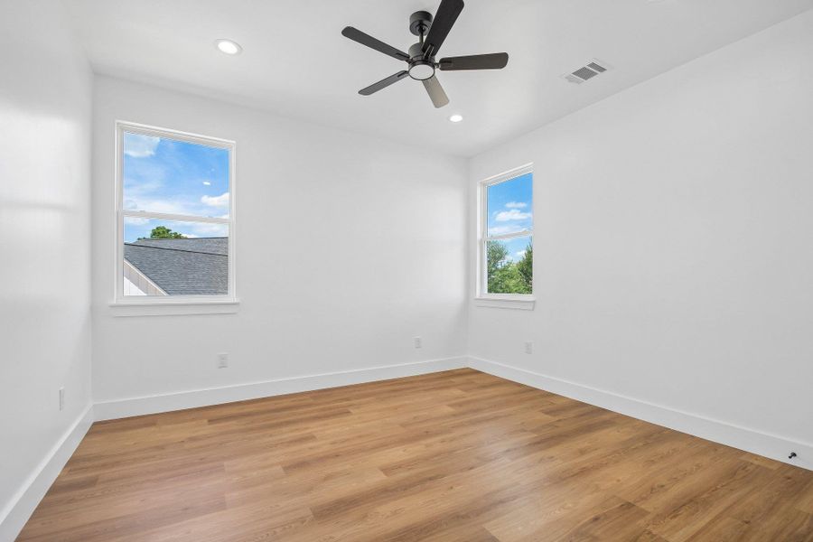 Crisp white walls and warm wood flooring define this versatile interior space. Crisp white walls and warm wood flooring define this versatile interior space.