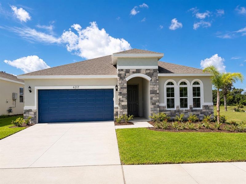 Front exterior of a new home in , Okahumpka, FL, highlighting curb appeal (Image 1). Front exterior of a new home in , Okahumpka, FL, highlighting curb appeal (Image 1).