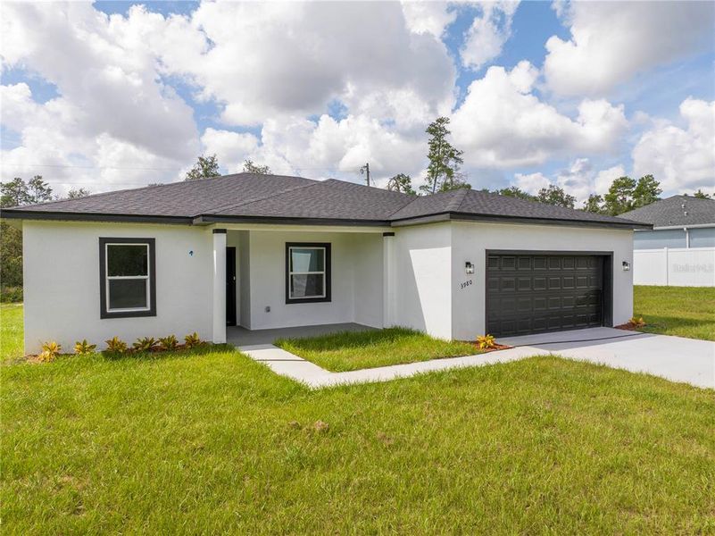 Front exterior of a new home in , Ocala, FL, highlighting curb appeal (Image 2).