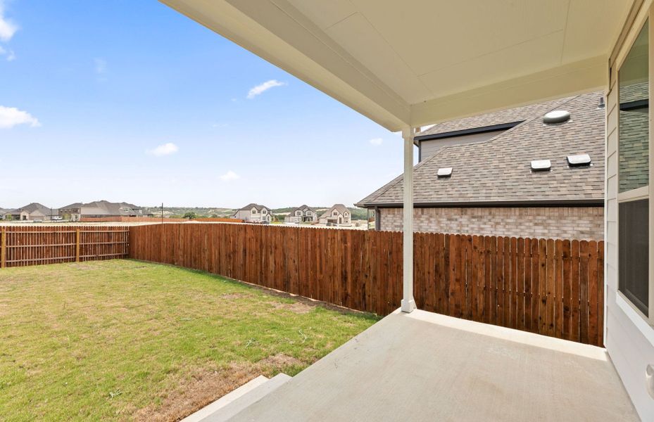 Exterior details and patio area of a home in Saddleback at Santa Rita Ranch, Liberty Hill (Image 24).