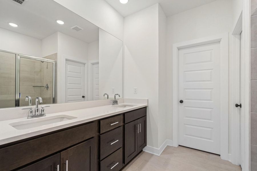 Dual vanity with undermount sinks and chrome fixtures