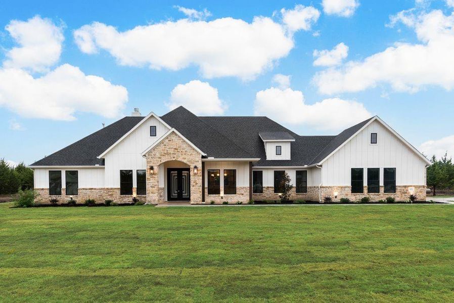 View of front of house with a front yard