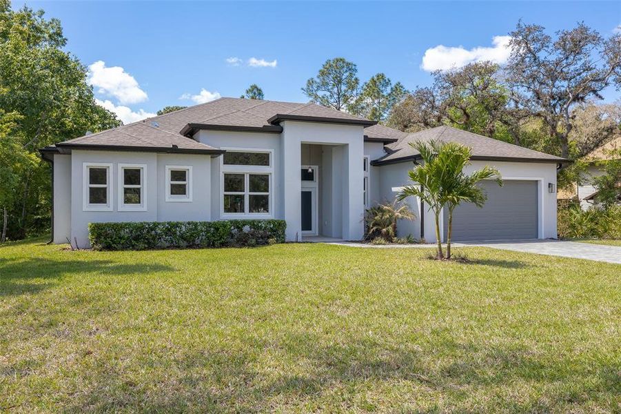 Front exterior of a new home in , Kissimmee, FL, highlighting curb appeal (Image 26). Front exterior of a new home in , Kissimmee, FL, highlighting curb appeal (Image 26).