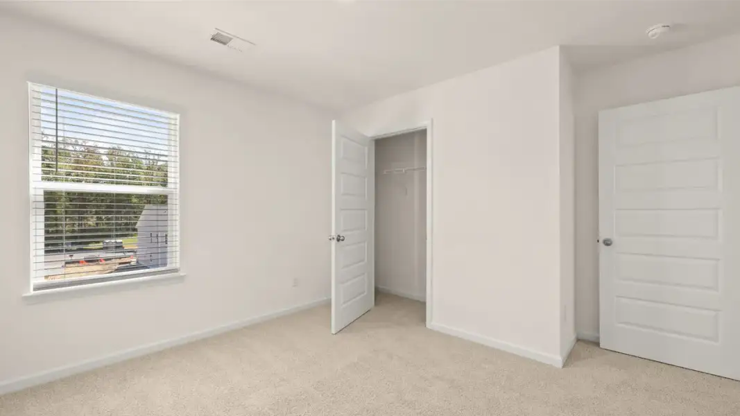 Spacious, unfurnished interior of a new home in The Highlands at Cedar Hill Landing, Navassa (Image 22).